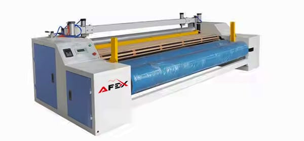 Cutting and roll winding machine